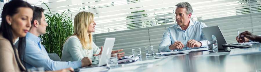 Meeting of cybersecurity professionals in a conference room