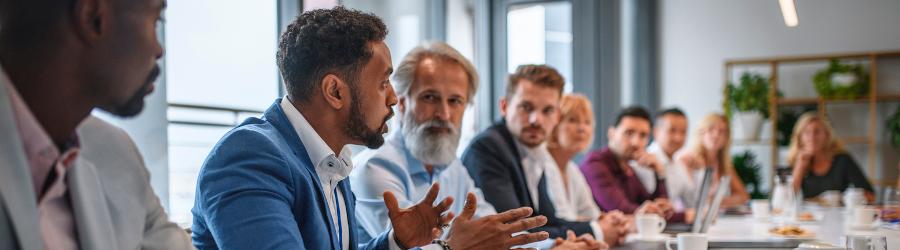 Cybersecurity professional talking in a business meeting