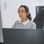 Cybersecurity professional working on a computer