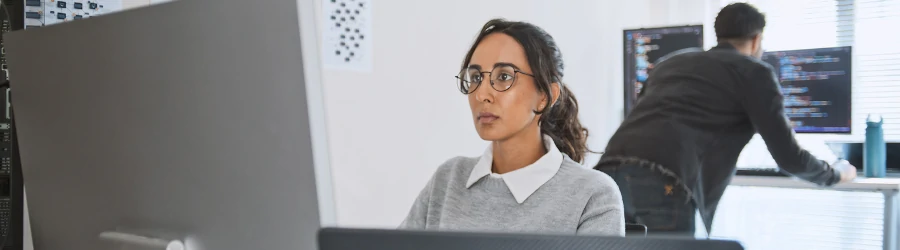 Cybersecurity professional working on a computer